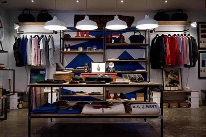 Stylish boutique interior with clothing and accessories on display.