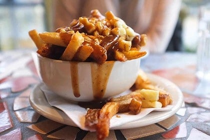 Delicious classic poutine served in a cozy Quebec bistro.