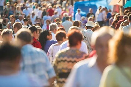 Bustling City Street with Walking Crowd