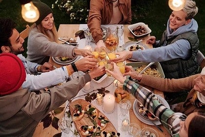 Friends Toasting at Iqaluit Group Dinner Event
