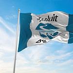Iqaluit flag waving against a clear blue sky