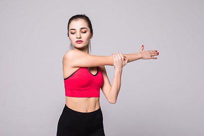 fitness woman doing stretching workout young woman white wall stretching motivation