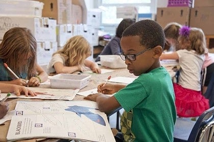 Canadian elementary school students engaged in classroom activities.
