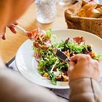 Person dining at a cozy Canmore restaurant.