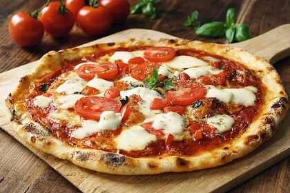 Authentic Italian Margherita pizza with fresh basil and mozzarella.