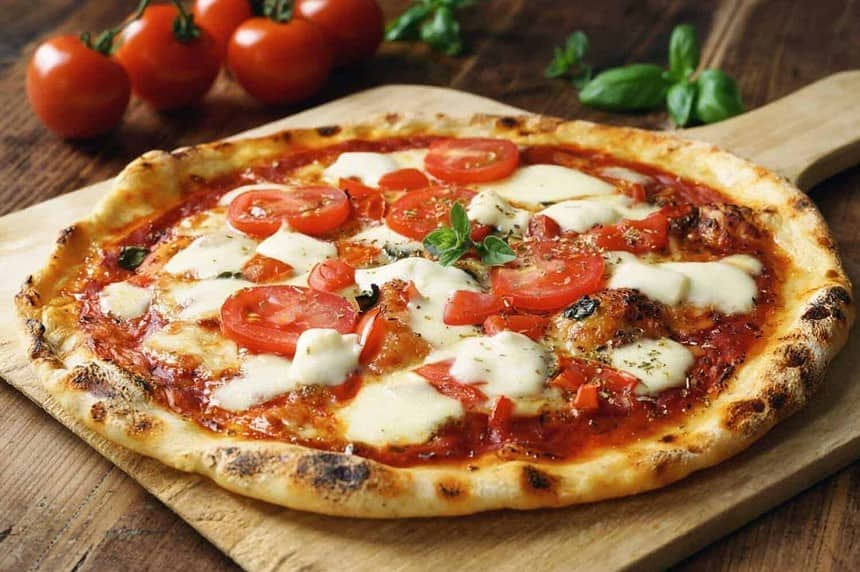 Authentic Italian Margherita pizza with fresh basil and mozzarella.