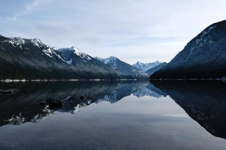 Serene Chilliwack Lake with mountain reflections at dusk.