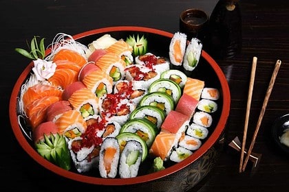 Assorted sushi platter with fresh sashimi and rolls.