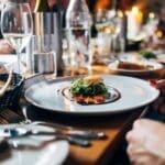 Fine dining in Banff restaurant with elegant table setting.