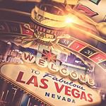 Las Vegas casino excitement with roulette wheel and slot machines.