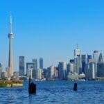 Toronto skyline and CN Tower viewed from waterfront park.