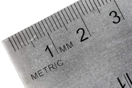 Close-up of a metric stainless steel ruler showing millimeter markings.