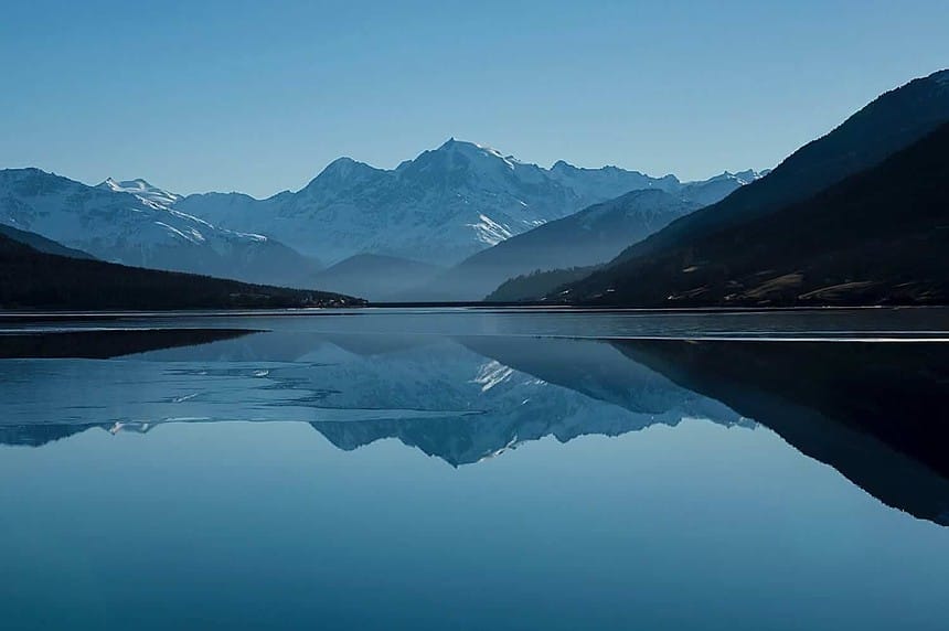 Tranquil Two Jack Lake with mountain reflections