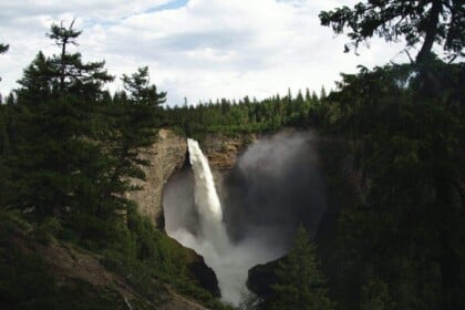 Majestic Helmcken Falls surrounded by forest in British Columbia.