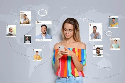 Woman browsing online dating profiles on smartphone.