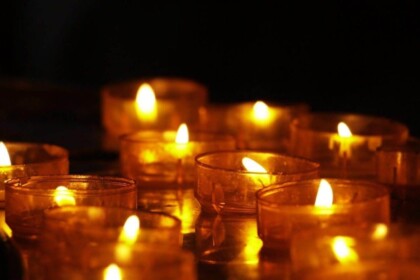 Warm candlelight ambiance with multiple tea lights.