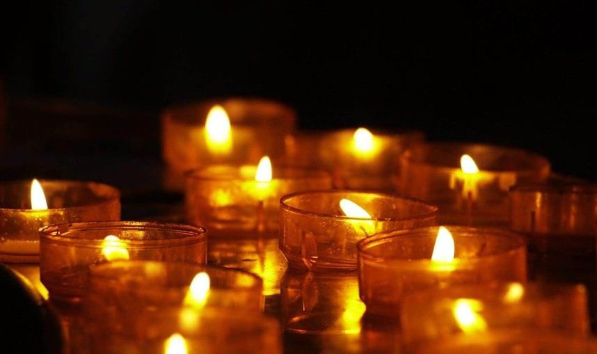 Warm candlelight ambiance with multiple tea lights.