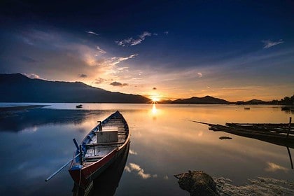 Sunset at Lake Koocanusa with canoe and mountains.