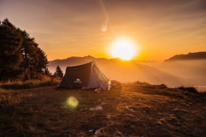 Tent camping at sunrise in scenic Ontario wilderness.
