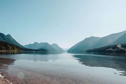 Tranquil lake with mountain range landscape