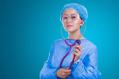 Confident female surgeon with stethoscope.