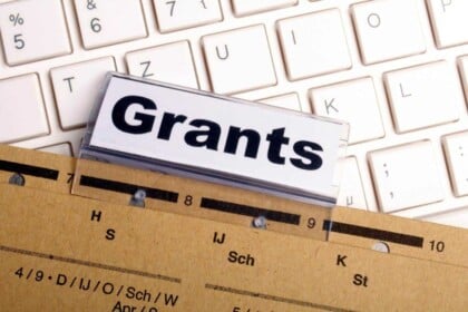 Grants text on label above folder with keyboard background