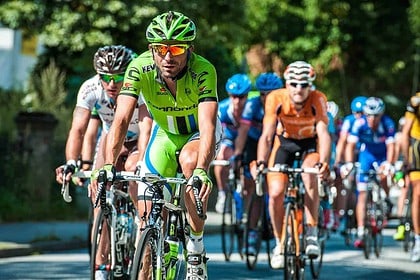 Cyclists competing in road racing event.