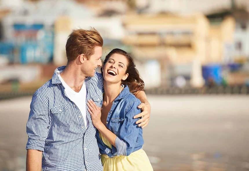 Young couple sharing a joyful moment together outdoors
