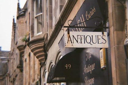 Vintage Ottawa antique shop storefront with sign.