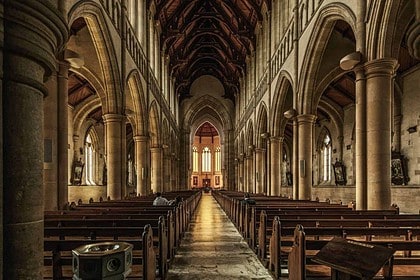 Majestic cathedral interior with Gothic arches and vaulted ceilings.