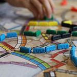 Interactive Vancouver mystery board game with colorful pieces.