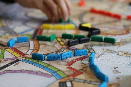 Interactive Vancouver mystery board game with colorful pieces.