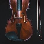Elegant Violin on Dark Background for Beatles Tribute Event