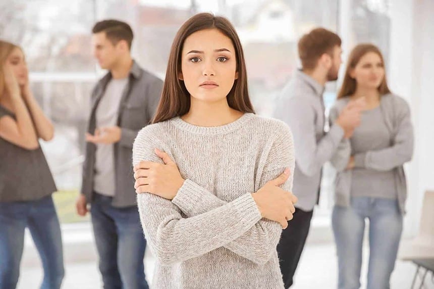 Woman feeling anxious at group therapy session.