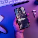 Person playing Call of Duty Warzone on iPhone 14 Pro.
