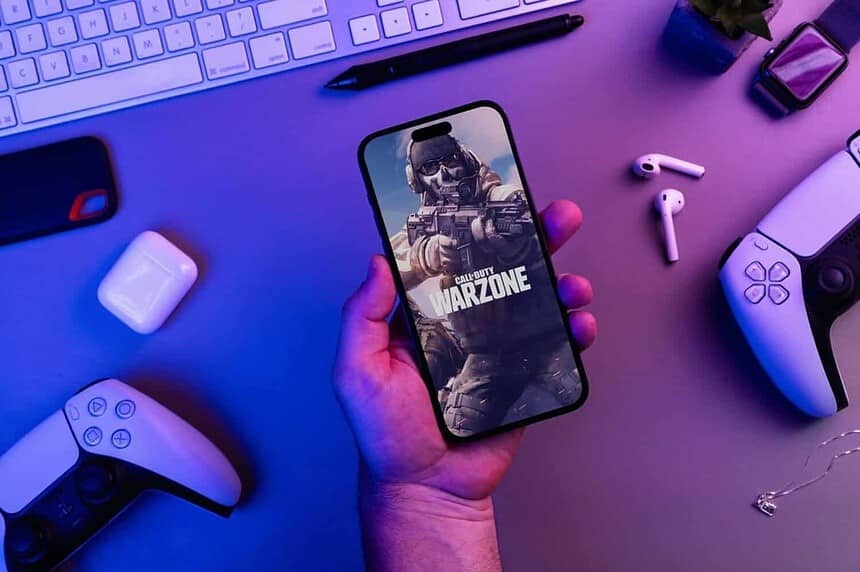 Person playing Call of Duty Warzone on iPhone 14 Pro.