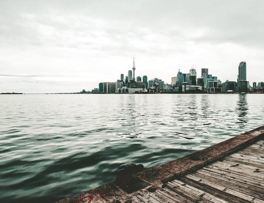 Tranquil lakefront with city skyline view