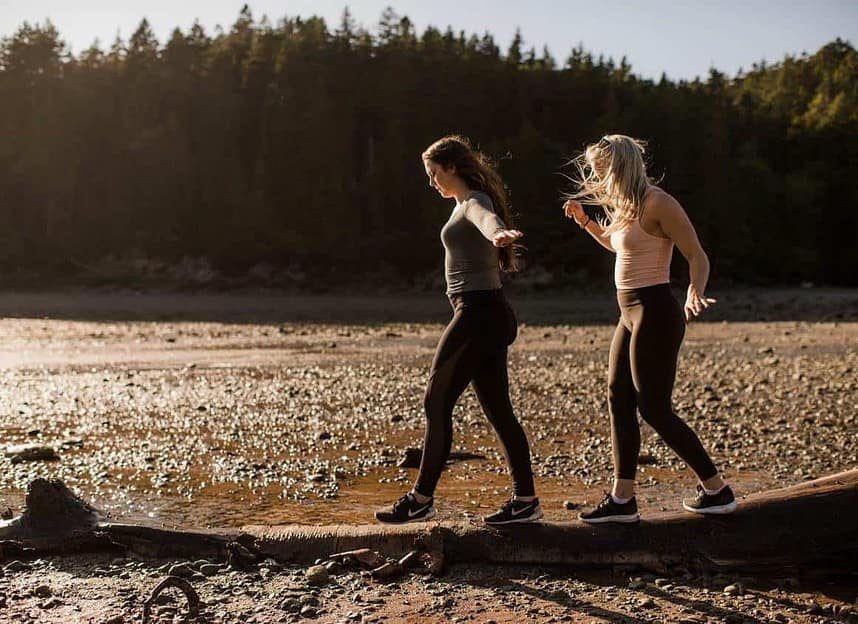 Hikers enjoying a sunny day at Fundy National Park trail.