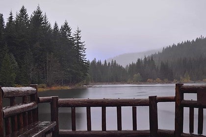 Misty Deer Lake view from wooden deck, Newfoundland.