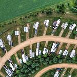 Aerial view of RV campground with greenery