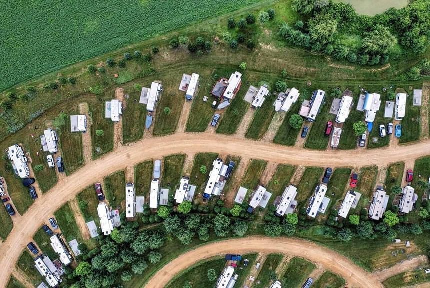 Aerial view of RV campground with greenery