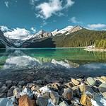 Scenic Canadian lake with turquoise waters and mountain landscape.