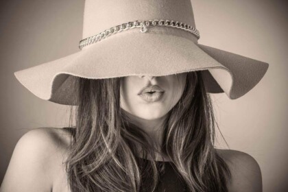 Elegant casino night outfit inspiration with oversized hat.