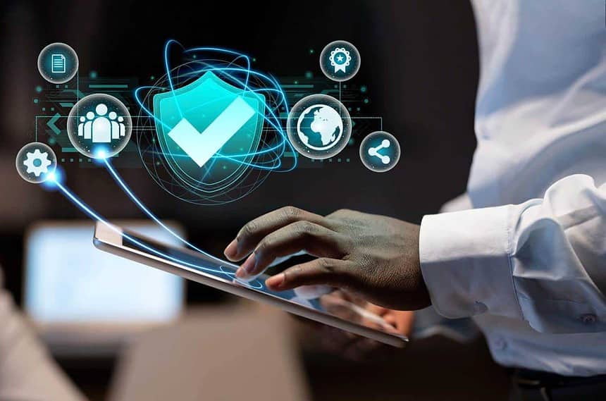Person using tablet with cybersecurity and data protection icons.