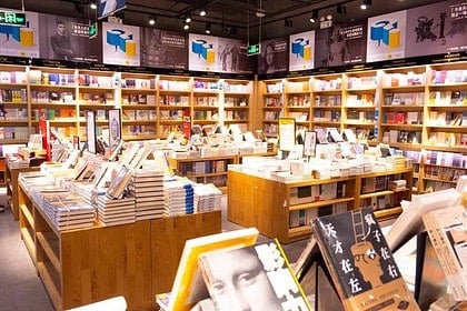 Cozy bookstore shelves stacked with books in Hamilton.