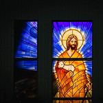 Stained glass window depicting Jesus in Langley church.