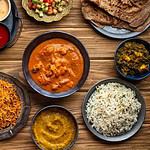 Assorted Indian dishes and condiments on table.