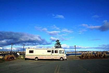 RV with ocean view under blue sky