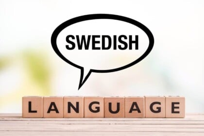 Swedish language concept with speech bubble and blocks.