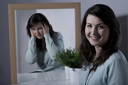 Woman reflecting on bipolar disorder experiences.